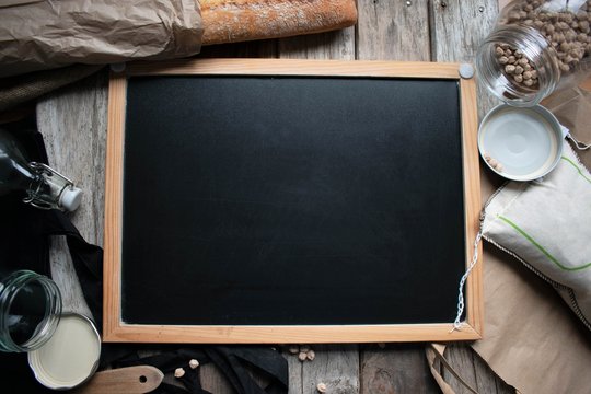 Blank blackboard with copy space. Natural food, flat lay.