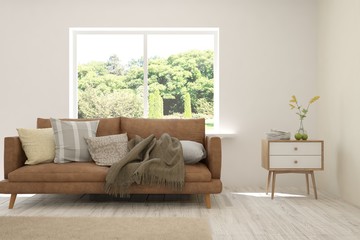 Stylish room in white color with sofa and summer landscape in window. Scandinavian interior design. 3D illustration