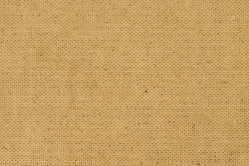 brown fiberboard wall texture background closeup
