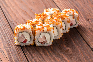 Sushi set on the wooden table. Closeup of delicious japanese food with sushi roll.