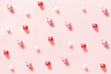  Christmas baubles on a light pink background