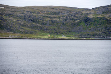 isolated houses at little bay on Rolvsoya island, Norway