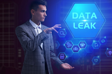 The concept of business, technology, the Internet and the network. A young entrepreneur working on a virtual screen of the future and sees the inscription: Data leak