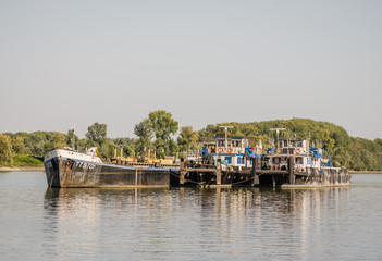 Fototapeta na wymiar Tankers anchored on the Danube river near Novi Sad