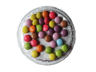 Assorted jelly beans on wooden table. Top view. Isolated.