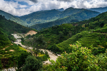 Naklejka na ściany i meble Mountain road in beautiful valley. Ha Giang province. Vietnam