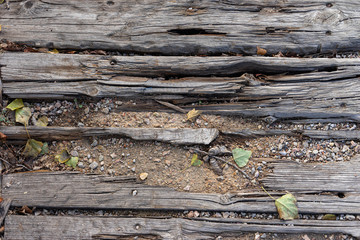 Weathered wooden footpath texture as background