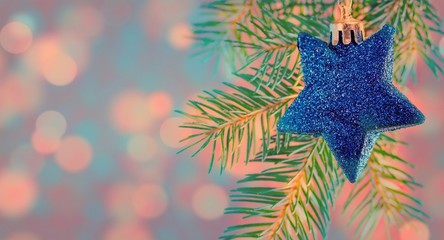 christmas tree with decorative ball and lighting,merry christmas theme,golden and mirror balls decored on cristmas tree,the golden star put on top cristmas tree,selective focus