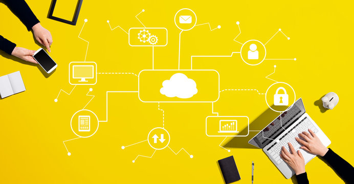 Cloud computing with people working together with laptop and phone