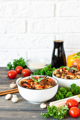 Wheat noodles udon with mushrooms and vegetables in Tereyaki sauce