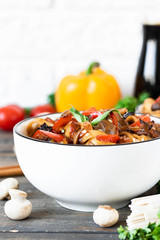 Wheat noodles udon with mushrooms and vegetables in Tereyaki sauce