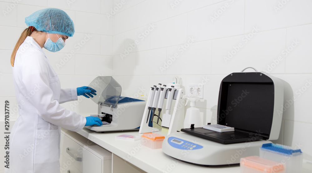 Poster young scientist working in biological laboratory with sample