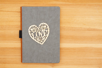 Blank gray leather book with heart