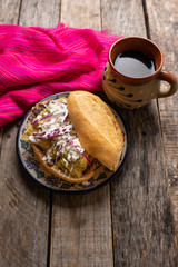 Mexican green chilaquiles sandwich with cheese also called 