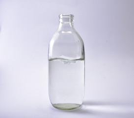 Glass bottles and white water waves