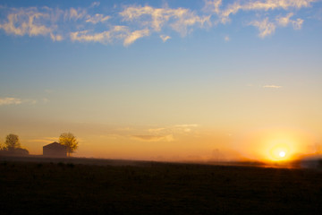 Fototapeta na wymiar Sunrise Over Farm