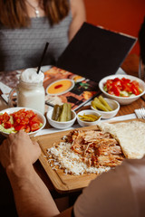 doner with rice on wooden board