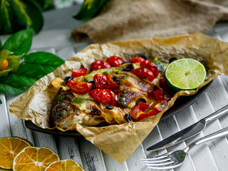 fried fish with vegetables on the table