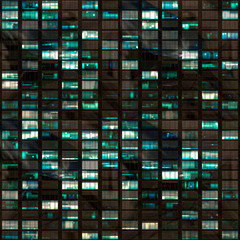 .265/5000.Building facade at night with some windows illuminated and some not. Urban night detail. © The Pick Shop