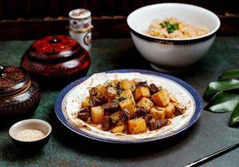 lamb spleen plate served with potato cubes garnished with dill