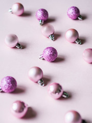 Christmas composition. Pink background and pink different Christmas ball. Copy space