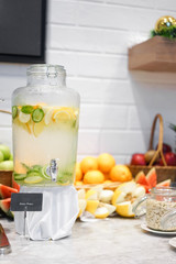 fresh fruit juice. Detox water refreshment. Selective focus on the Detox water container with blurred of fresh fruits on the background.