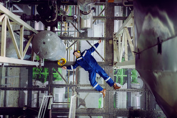 Top view of unconscious plant worker. Injury at work concept.