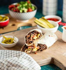 meat doner with lavash on wooden board