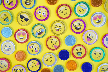 Chocolate coins. Top view photo of chocolate coins with various expressions, pop art style, on a...