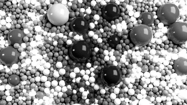 4к 3D looped animation with beautiful black and white small and large spheres or balls as an abstract geometric background. Beautiful composition with a plane is covered black and white balls