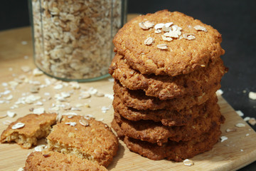 Homemade oatmeal cookie at dark background	