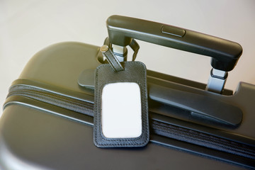 Black luggage and blank tag