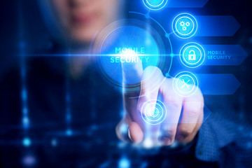 Fototapeta premium The concept of business, technology, the Internet and the network. A young entrepreneur working on a virtual screen of the future and sees the inscription: Mobile security.