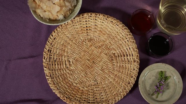 a Japanese female chef picking up DAIKON (mooli) from her kitchen table, Tokyo, Japan. July 2019. Camera fixed, close up, bird's eye view