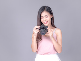 Fototapeta premium Beautiful and charming women dressed in casual style, carrying film cameras