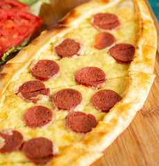 turkish pide with sausage and cheese