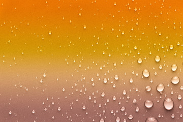 Drops of water on a color background