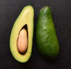 green avocado cut with a bone inside