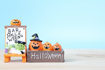Halloween holiday background concept : Halloween decoration on table and blue background with copy space, ready for adding or mock up