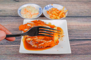 Chicken chop in white plate , coleslaw and french fries  on wood background