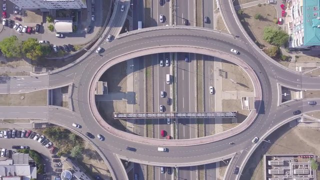 Descending aerial shot of Roundabout and highway, 4k traffic