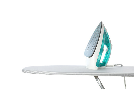 Iron on ironing board isolated on white background