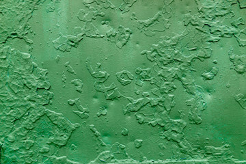 Abstract background of peeling paint renewed on top of old fragments.