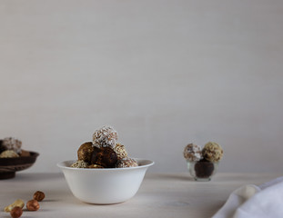 Energy protein balls on a white background. This is a very healthy and delicious product consisting of nuts, dried fruits and peanut paste.