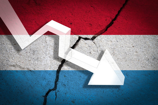 Luxembourg Flag on the cracked wall with arrow falling down. Concept of decrease in the country.