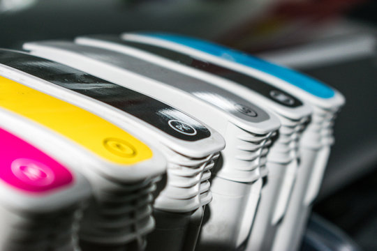 Close detail of ink cartridges in plotter for printing