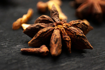 star anise and cinnamon on wooden background macro