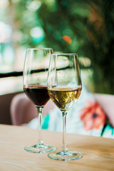 a glass of white and red wine in the cafe