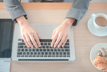 Fototapeta na wymiar business woman working typing laptop computer