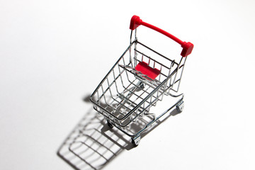 Empty shopping trolley isolated on white, closeup